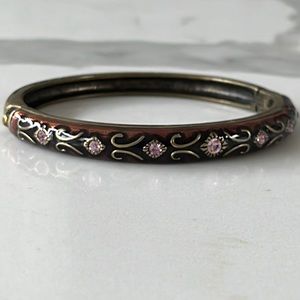 Dark metallic bracelet with purple stones.